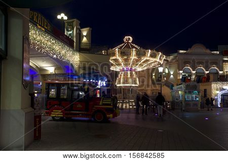 VIENNA, AUSTRIA - DECEMBER 31 2015: People at night at Prater amusement park in Vienna Austria