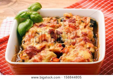 Casserole with roasted eggplants stuffed with minced meat.