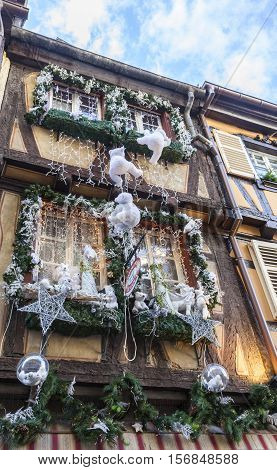 ColmarFrance - December 62013: Detail of a traditional winter olidays decoration on a half-timbered house in ColmarAlsaceFrance on December 62013.
