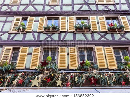 ColmarFrance - December 62013: Detail of a traditional winter olidays decoration on a half-timbered house in ColmarAlsaceFrance on December 62013.