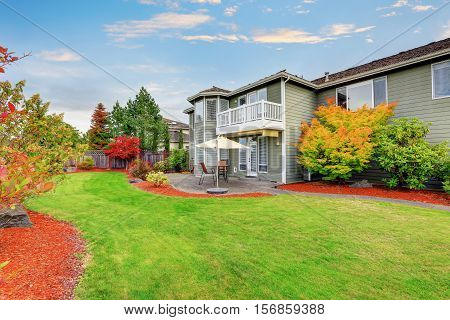 Well Kept Backyard Garden And Patio Area Of American House.
