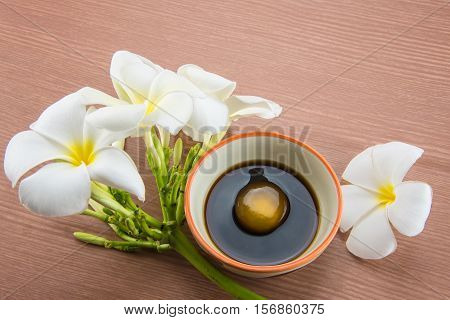 Raw Egg in soy sauce and Plumeria flower,Tamago kake gohan