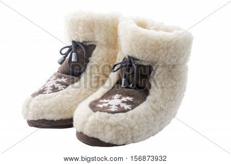 White slippers on the wooden background .