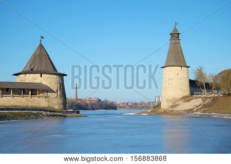 The old towers of the Pskov Kremlin on the place of confluence of Pskova and Velikaya on the sunny February day. Pskov Kremlin, Russia