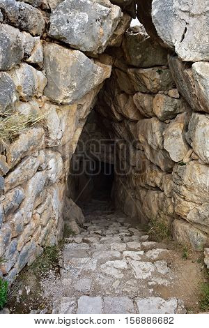 The entrance to the dungeon. The archaeological sites of Mycenae and Tiryns have been inscribed upon the World Heritage List of UNESCO