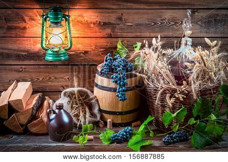 Grapes And Red Wine In A Demijohn