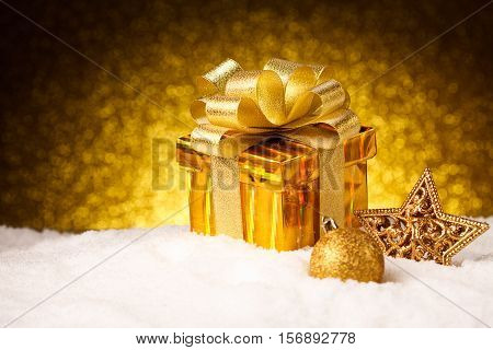 Christmas present with christmas decoration on snow. Happy new year