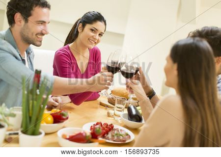 Young People Sitting By The Table