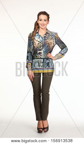 woman with loose hair style inprint leopard blouse trousers high heels shoes full length body portrait standing isolated on white