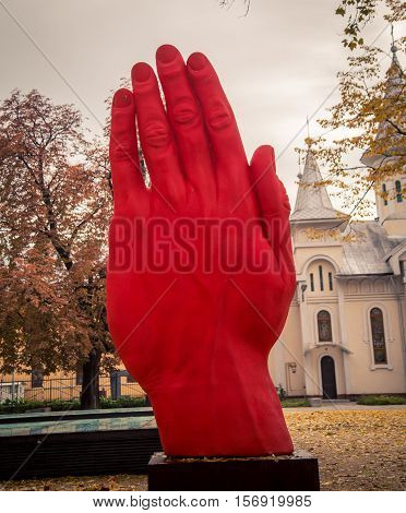 statue of a red hand in baia mare romania