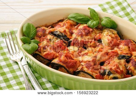 Casserole with roasted eggplants stuffed with minced meat.
