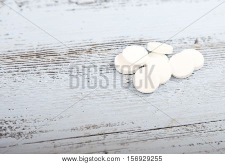 Traditional Dutch white candy Pepermunt on wooden background