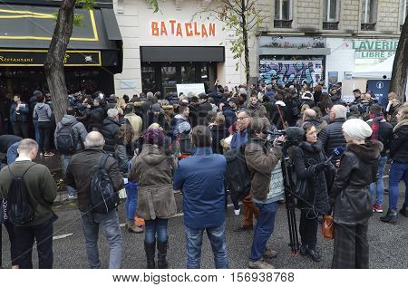 Paris,  France - November 13, 2016:  Crowd in front of the Bataclan paying tribute to the victims of the terrorist attacks