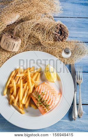 Hot French Fries With Salmon With Lemon