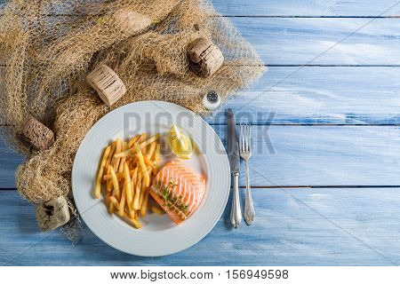 Homemade French Fries With Salmon With Lemon