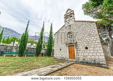 Virgin Mary church on graveyard in Tucepi, Croatia.