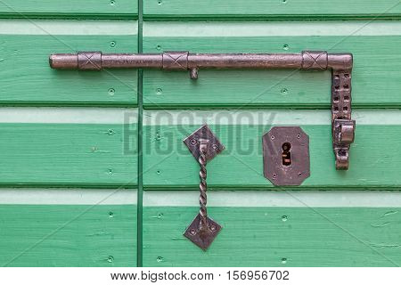 Detail of old wooden door lock of the typical house in Tucepi village, Croatia.