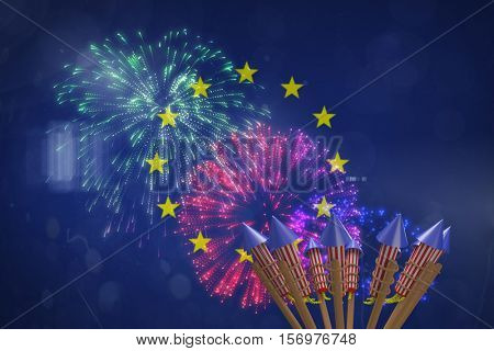 Rockets for fireworks against colourful fireworks exploding on black background