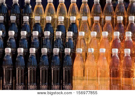 Aromatic homemade brandy in souvernir bottles on traditional market