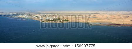 Aerial view on the coast in Namibia and modern districrt of the city Walvis Bay in the Namib desert Atlantic ocean Africa