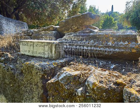Ancient Agora Of Athens With The Acropolis In Background. Greece.
