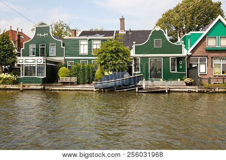 Traditional, Authentic Dutch Houses And Boat At The Canal.
