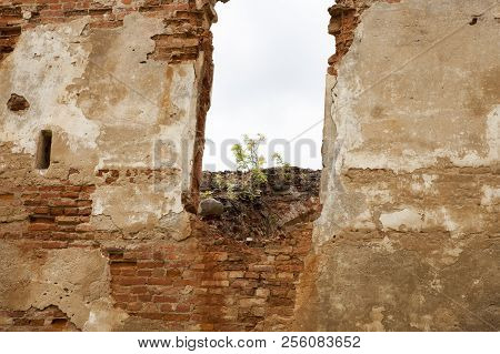 Cloudy Weather And The Ruins Of An Old Fortress Of Red Brick, Decayed And Destroyed As A Result Of B