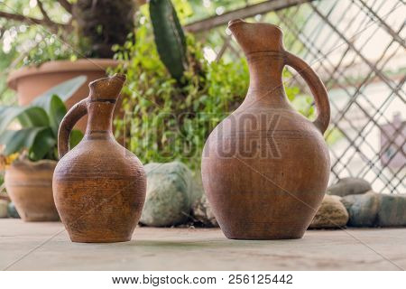 Traditional Clay Wine Jugs In The Garden
