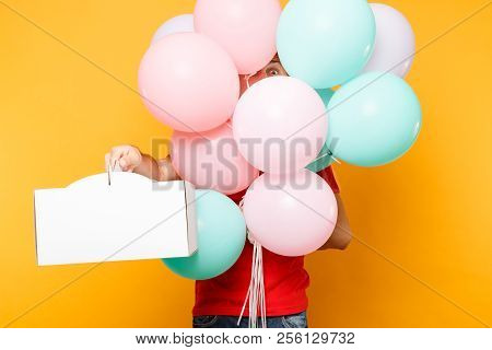 Man Giving Food Order Cake Box Isolated On Yellow Background. Male Employee Courier In Red Cap T-shi
