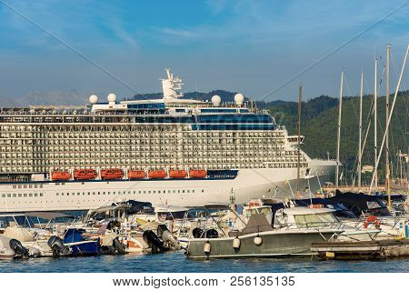 Luxury Cruise Ship In The Port Of La Spezia. In The Background The Apuan Alps (alpi Apuane). Liguria