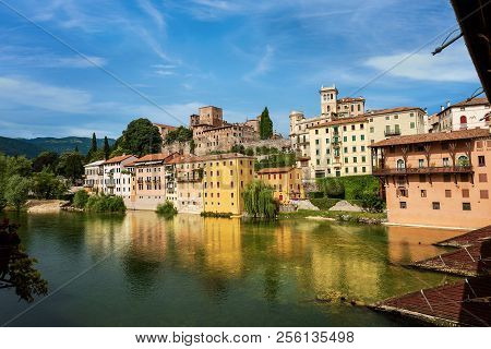 Bassano Del Grappa Town And The River Brenta Seen From The Famous Ponte Degli Alpini Or Ponte Vecchi