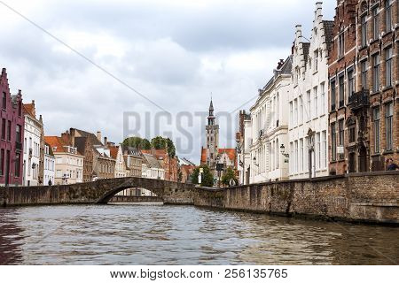 Bruges, Belgium-august 15, 2015-tower Of Poortersloge, Aka Burghers Lodge And The Medieval Houses At