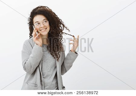 Portrait Of Flirty Good-looking Caucasian Female Coworker In Grey Coat And Eyewear, Gazing Aside Wit