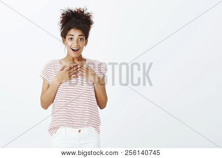 Girl Surprised With Unexpected Gift. Portrait Of Pleased Happy Charming Woman With Dark Skin And Com
