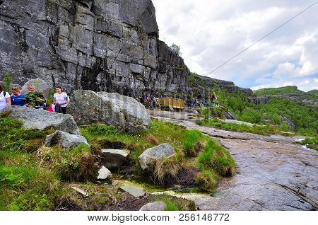 Lysefjord-norway, 05- June-2017 
  Tourists In Preikestolen Or Pulpit In Norway On A Day With Clouds