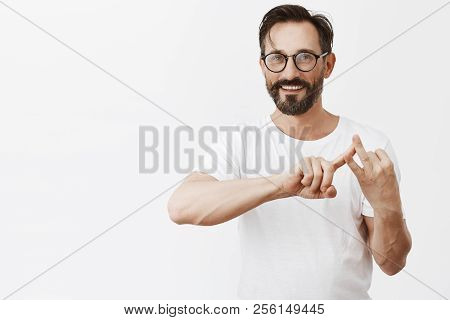 Man Listing Few Reasons Why He Stayed Home And Skipped Work. Portrait Of Handsome Happy Aduly Man Wi