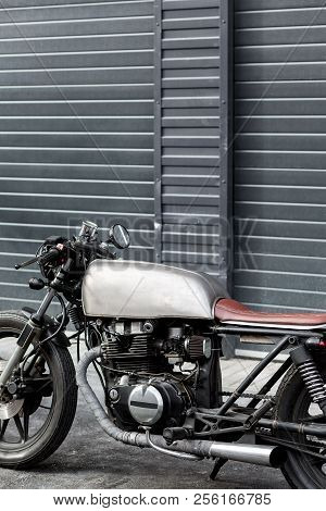 Caferacer Motorcycle Parking Near Finance Building. Everything Is Ready For Having Fun Driving The E