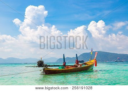 Traditional Long Tail Boat On Coral (ko He) Island Near Phuket Island, Thailand In A Summer Day