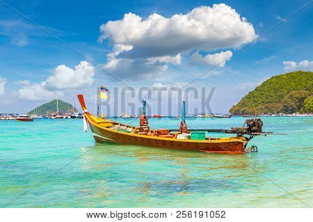Traditional Long Tail Boat On Coral (ko He) Island Near Phuket Island, Thailand In A Summer Day