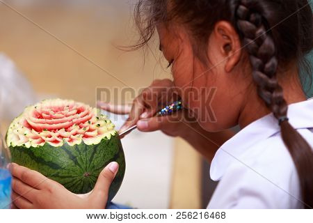 Nakhonratchasima, Thailand - August 31, 2018:asian Little Girl Carve Fruit In School