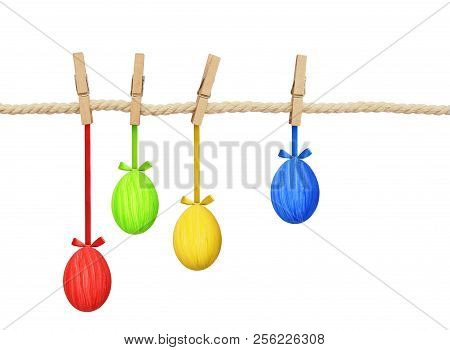 Cotton Rope And Four Pins With Hanging Easter Painted Eggs Isolated On White Background