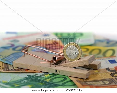 Close Up Of Euro Coin In Mousetrap As Bait On Banknotes With Copy Space. Concept Of Debt