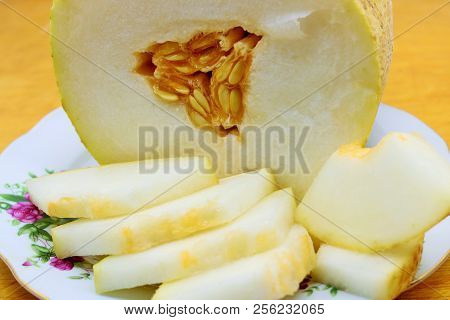 Melon Torpedo. Slices Of Melon On A Plate.