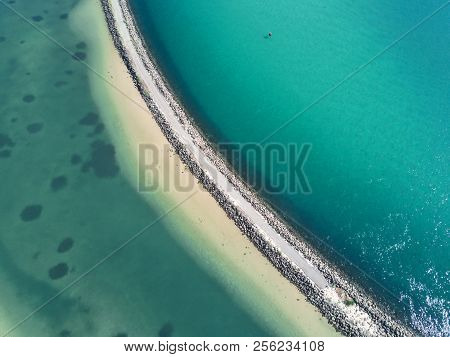 Ocean Abstract And Stone Breakwall With Space For Copy
