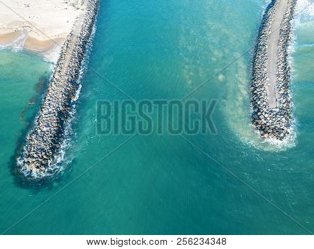 The Breakwall Groynes And Entrance To Lake Illawarra On The South Coast Near Wollongong