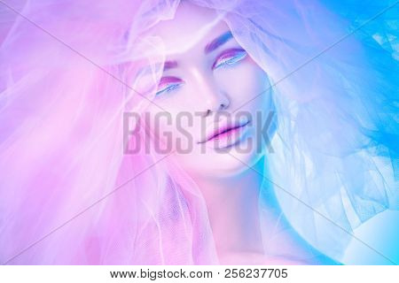 High Fashion art portrait model woman in colorful bright neon lights posing, portrait of beautiful fantasy girl, trendy make-up and colourful tulle hairdo, colorful make up, white skin, Vivid makeup