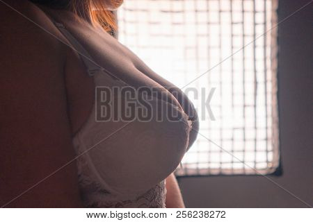 Large And Beautiful Women Breasts In White Bra