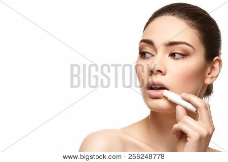 Girl Applying Pink Lipstick Isolated On White