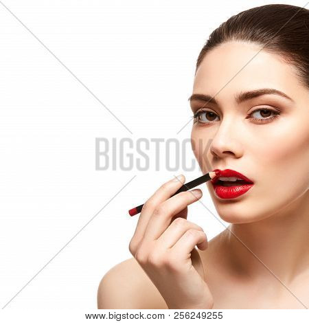 Girl Applying Red Lipstick Isolated On White