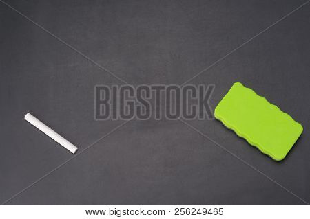 On The School Chalkboard There Is A Chalk And A Sponge For Its Erasure